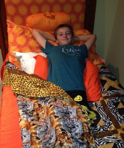 Alex Fisk was the excited winner of the HopeNet raffle for this beautiful safari quilt at the Avocado Festival in October 2014.